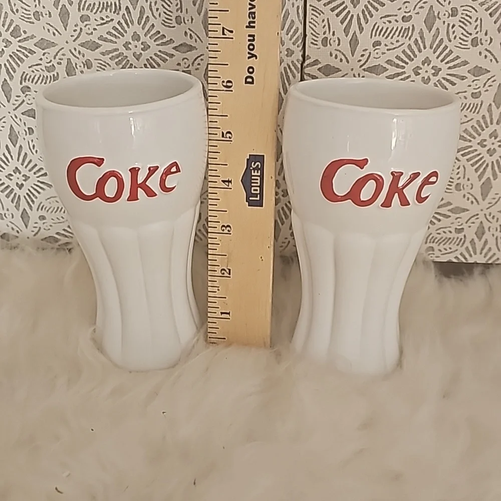 2 white with red raised lettering Coca Cola glasses vintage Germany
